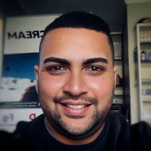 Ziyaad Galvaan at Krem Vape Studio Pinelands branch, ready to assist customers with expert vape advice.